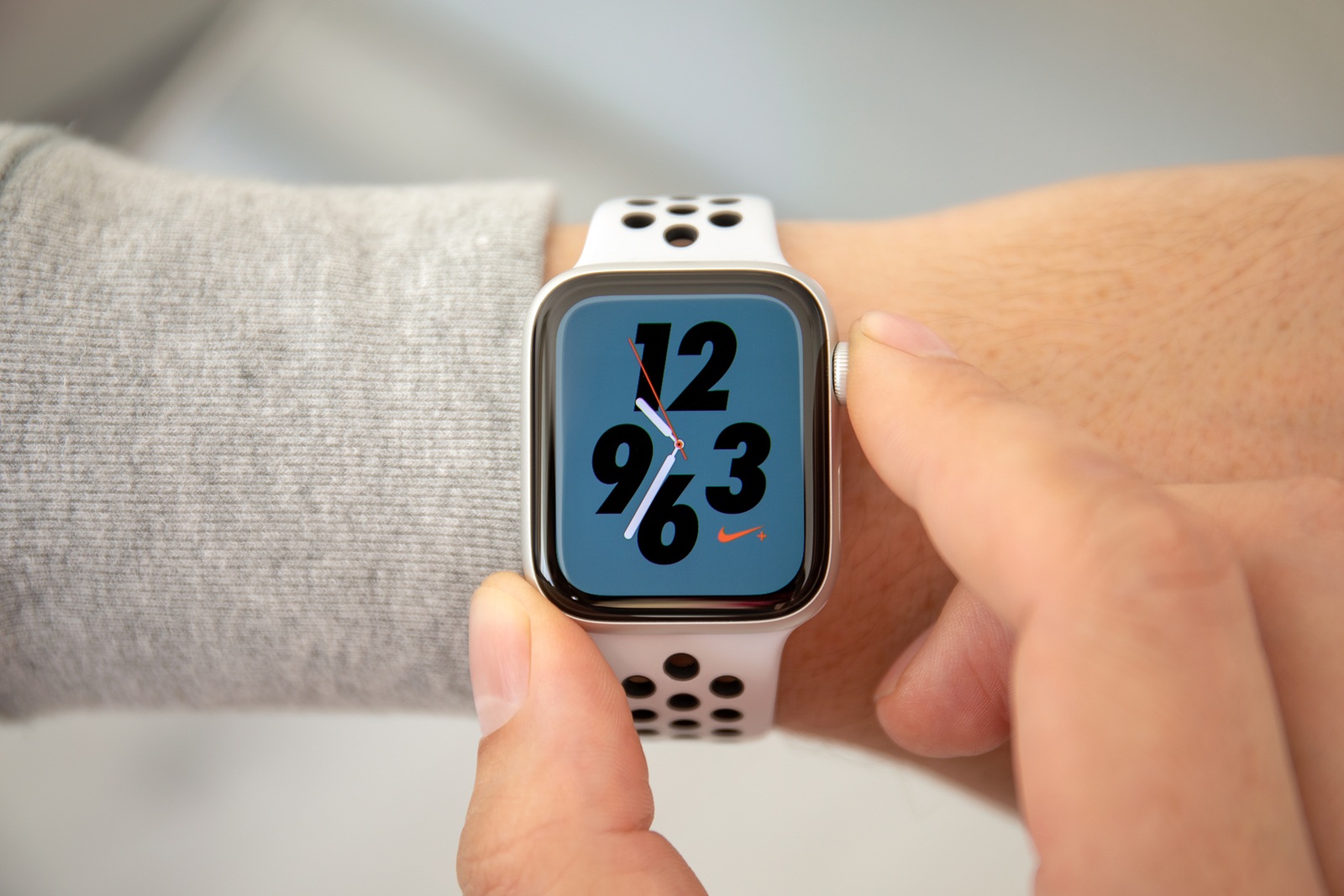 Alushta, Russia - November 6, 2018: Man hand with Apple Watch Series 4 with Nike Watch Face on the screen. Apple Watch was created and developed by the Apple inc.
