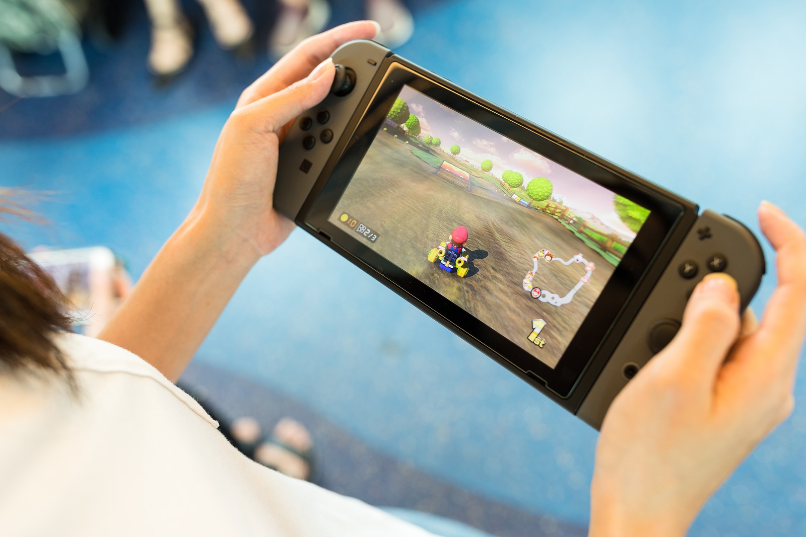 Hong Kong, 19 May 2017 -:Woman holding a Nintendo Switch with playing mario kart 8