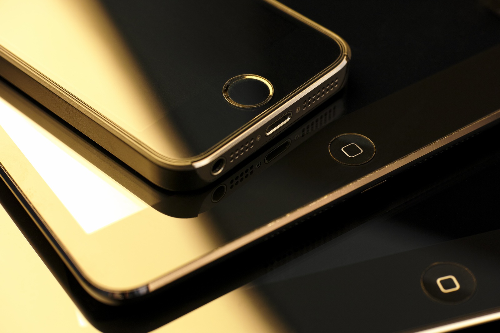 Tambov, Russian Federation - February 26, 2015 Close up of stack of Apple devices -  iPhone 5s, iPad mini and iPad 2. Studio shot.