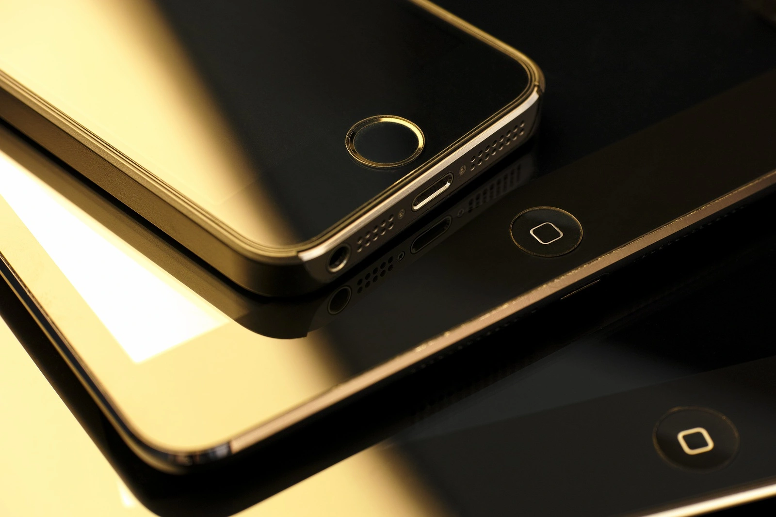 Tambov, Russian Federation - February 26, 2015 Close up of stack of Apple devices -  iPhone 5s, iPad mini and iPad 2. Studio shot.