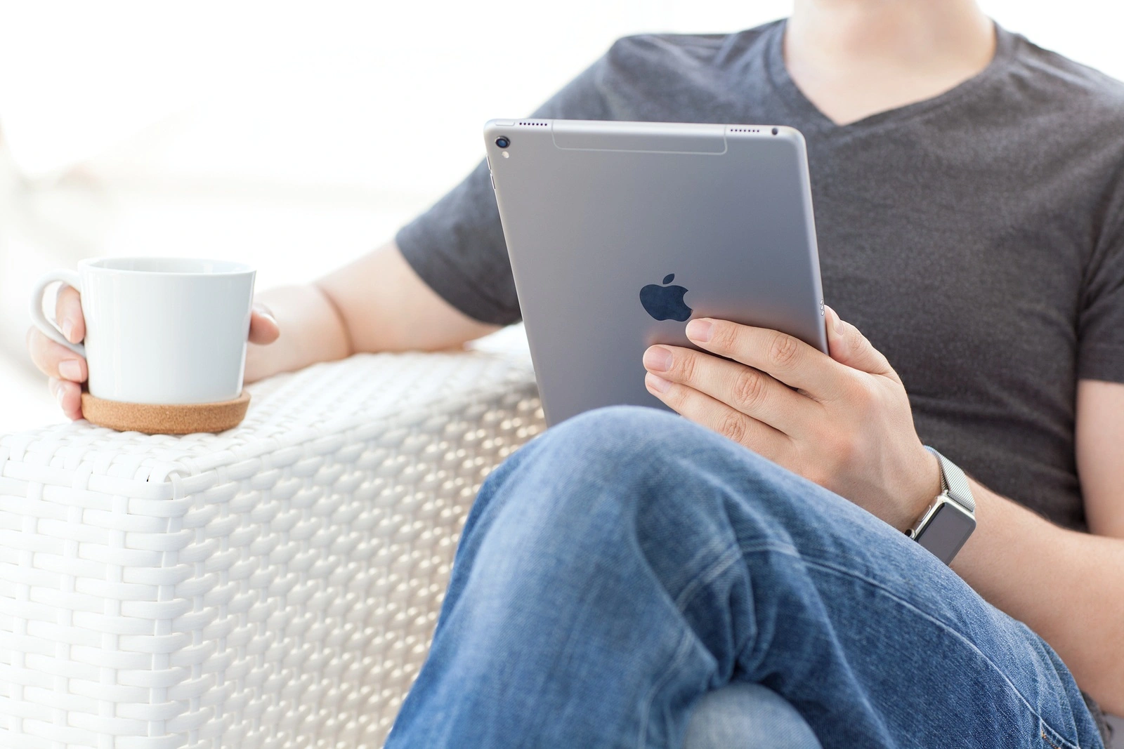 Alushta Russia - May 15 2016: Man with Apple Watch holding in the hand a new iPad Pro. iPad Pro was created and developed by the Apple inc.