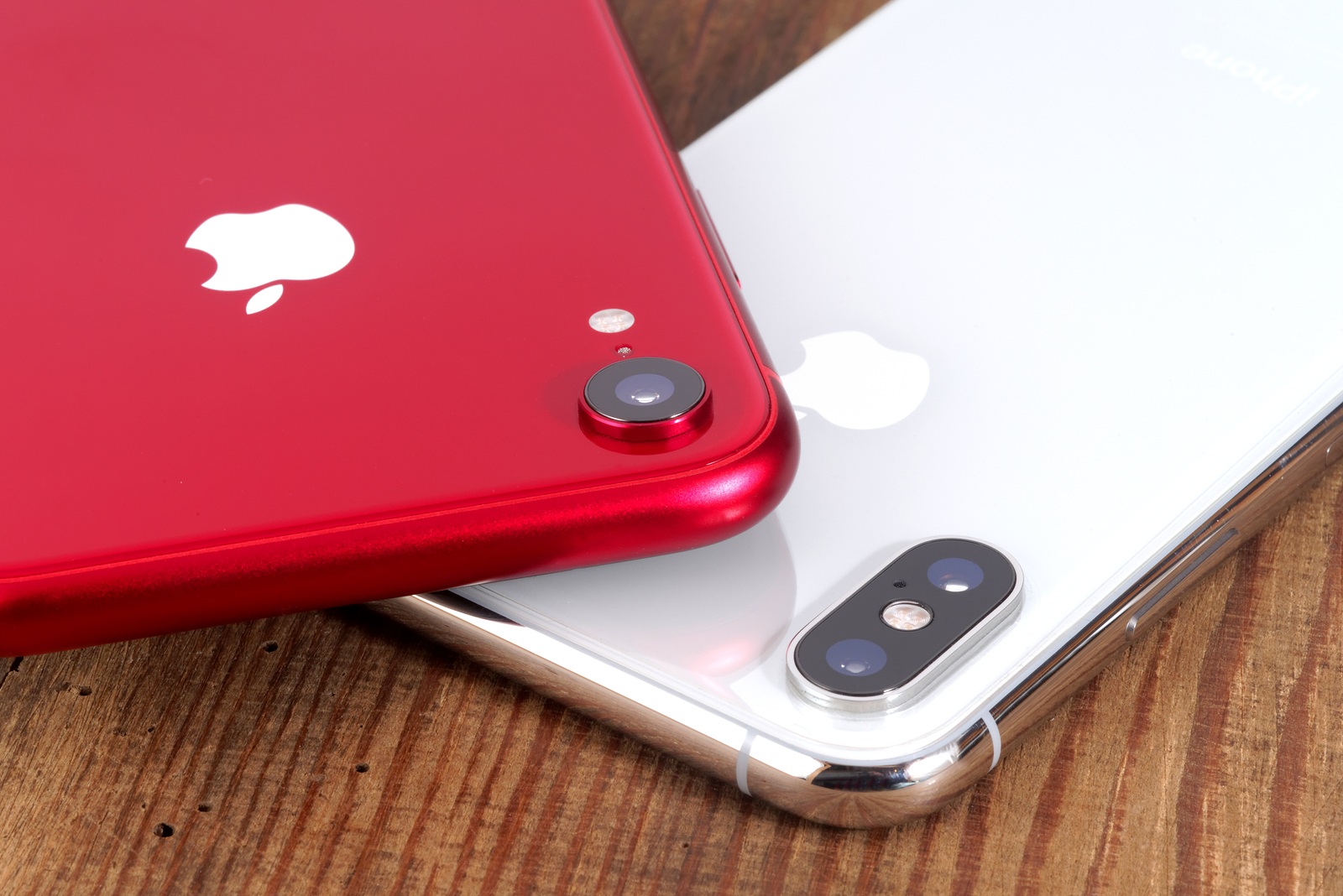 Koszalin, Poland - November 29, 2018: Silver iPhone Xs and red iPhone XR. The iPhone Xs and iPhone XR is smart phone with multi touch screen produced by Apple Computer, Inc.