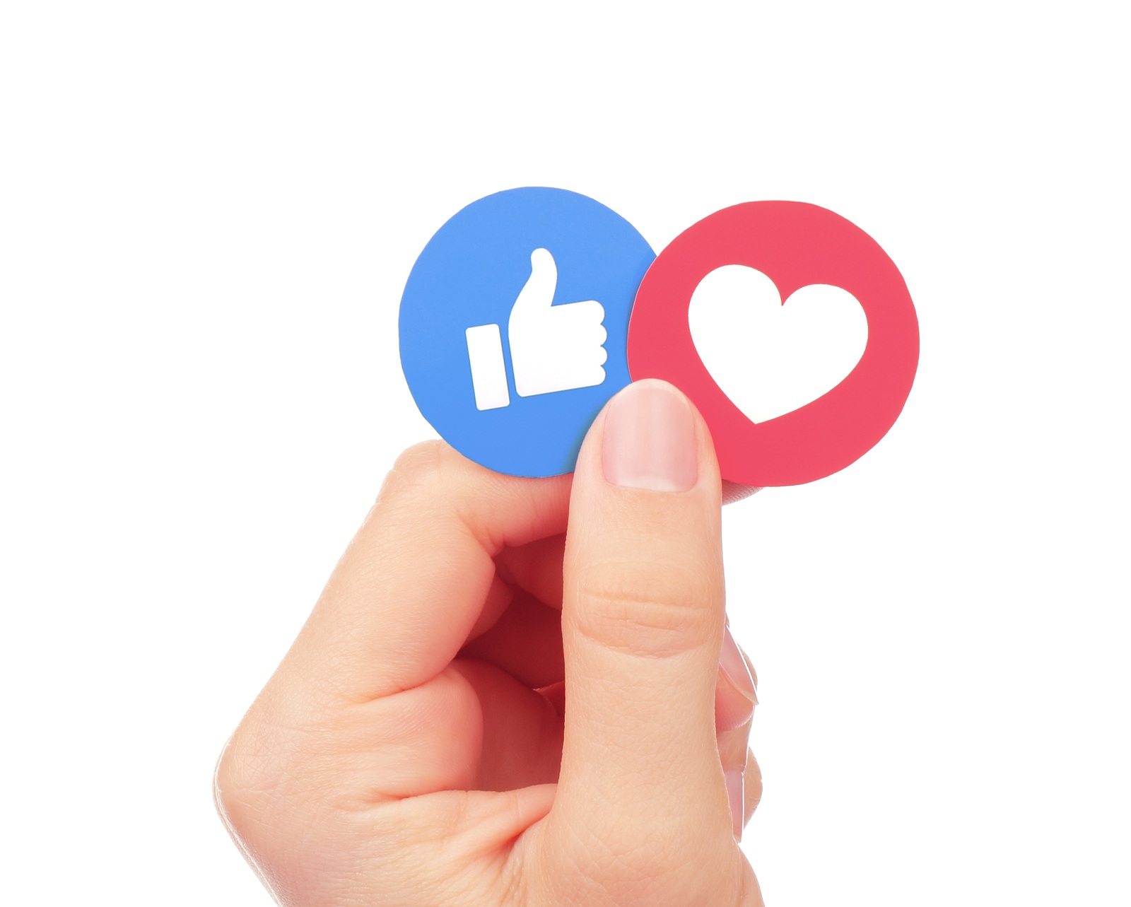 Kiev Ukraine - September 04 2017: Hand holds Facebook Like and Love Empathetic Emoji Reactions printed on paper. Facebook is a well-known social networking service