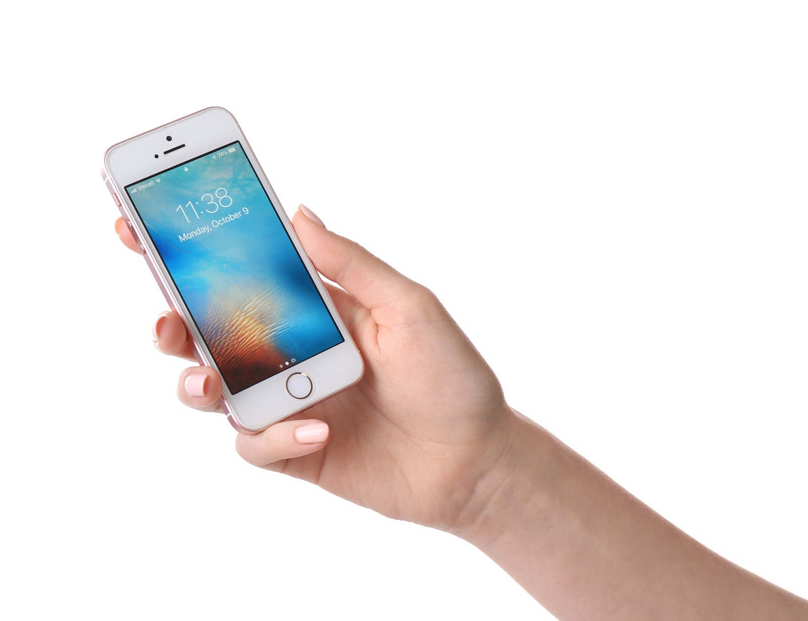 KIEV, UKRAINE - OCTOBER 09, 2017: Woman holding rose gold iPhone SE on white background