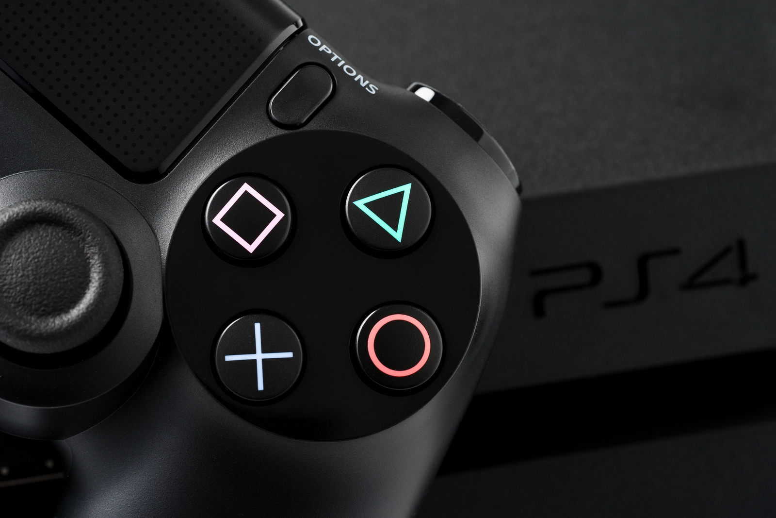Ufa Russia - 27 February 2016: The new Sony Dualshock 4 with PlayStation 4. Sony PlayStation 4 game console of the eighth generation.