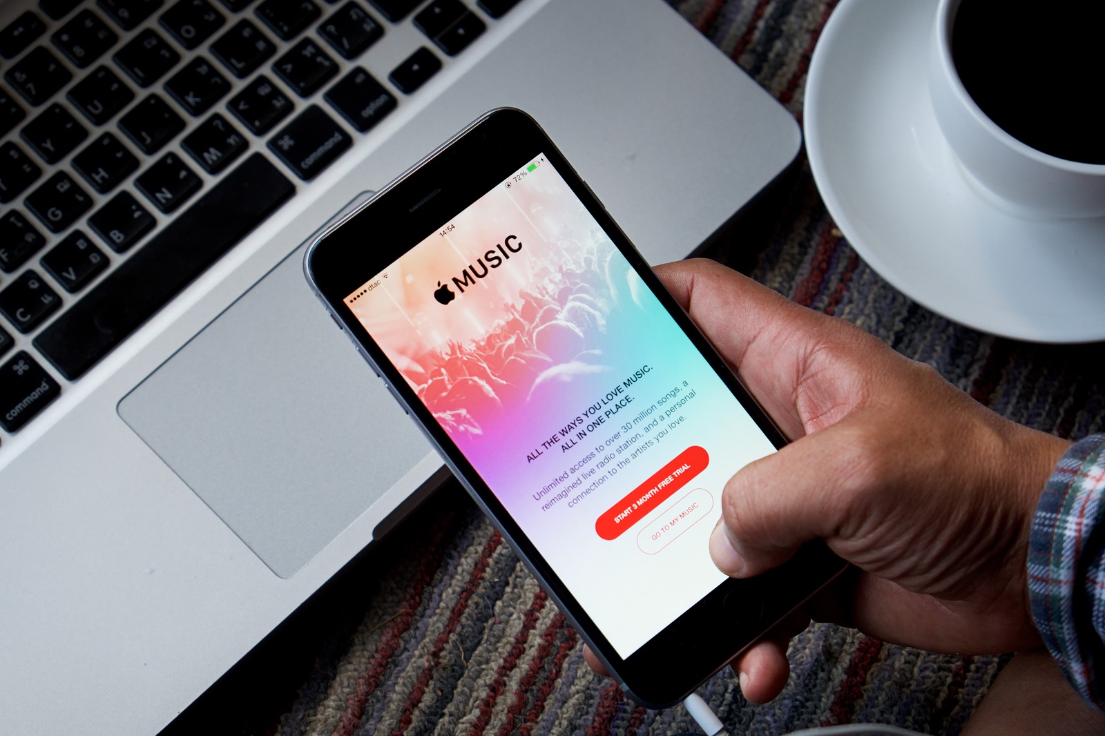 CHIANG MAI,THAILAND - SEP 16,2015 : A woman hand holding Apple music app showing on iPhone 6 plus. Apple Music is the new iTunes-based music streaming service that arrived on iPhone,
