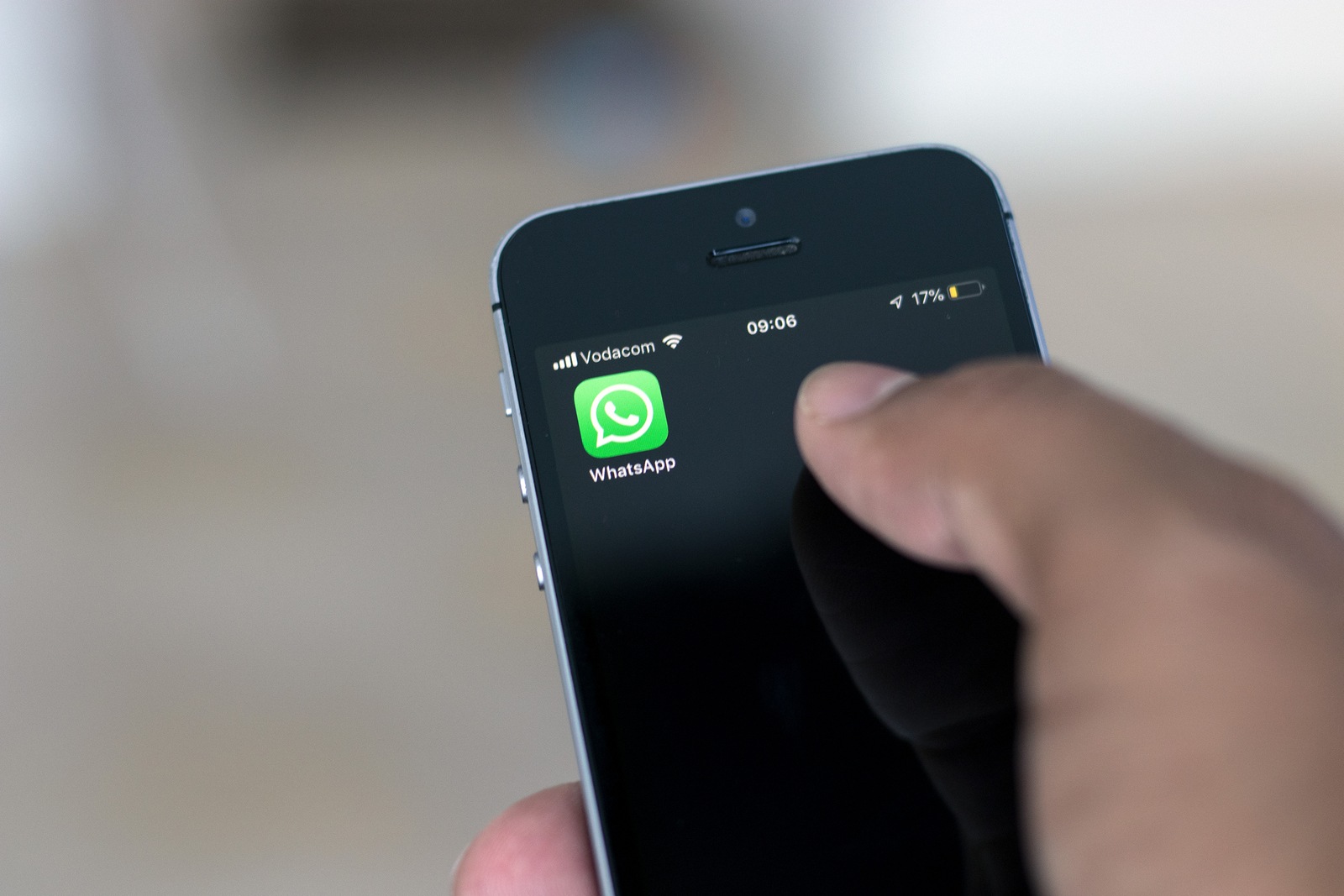 Cape Town, South Africa. 15 March 2019. Hand holding a mobile phone with the WhatsApp icon on screen.