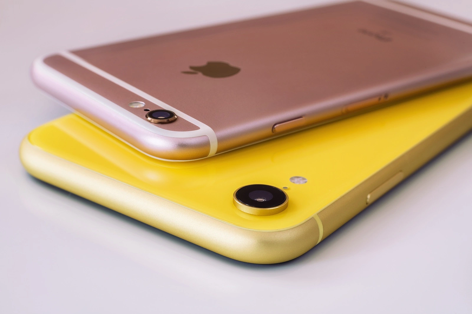 22.08.2019 Ukraine: Closeup yellow iphone xr and pink iphone 6s on isolated background