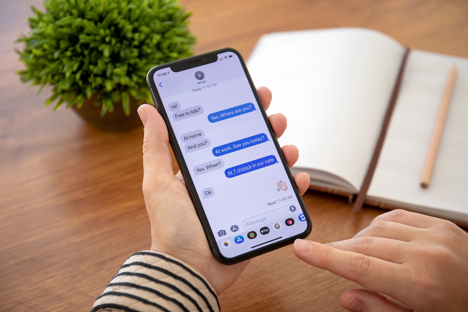 Alushta, Russia - September 26, 2018: Woman hand holding iPhone X with social networking service iMessage on the screen. iPhone 10 was created and developed by the Apple inc.