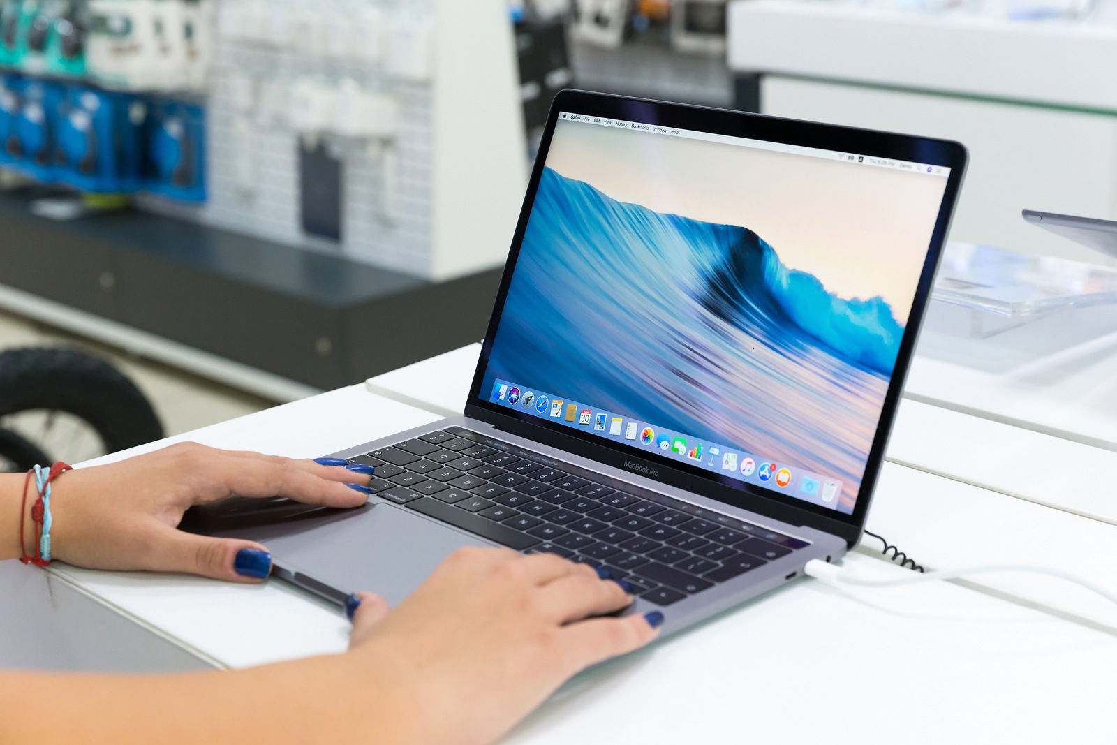 Belgrade, Serbia - August 30, 2018: New MacBook Pro laptop with macOS on the screen is displayed in electronic store.
