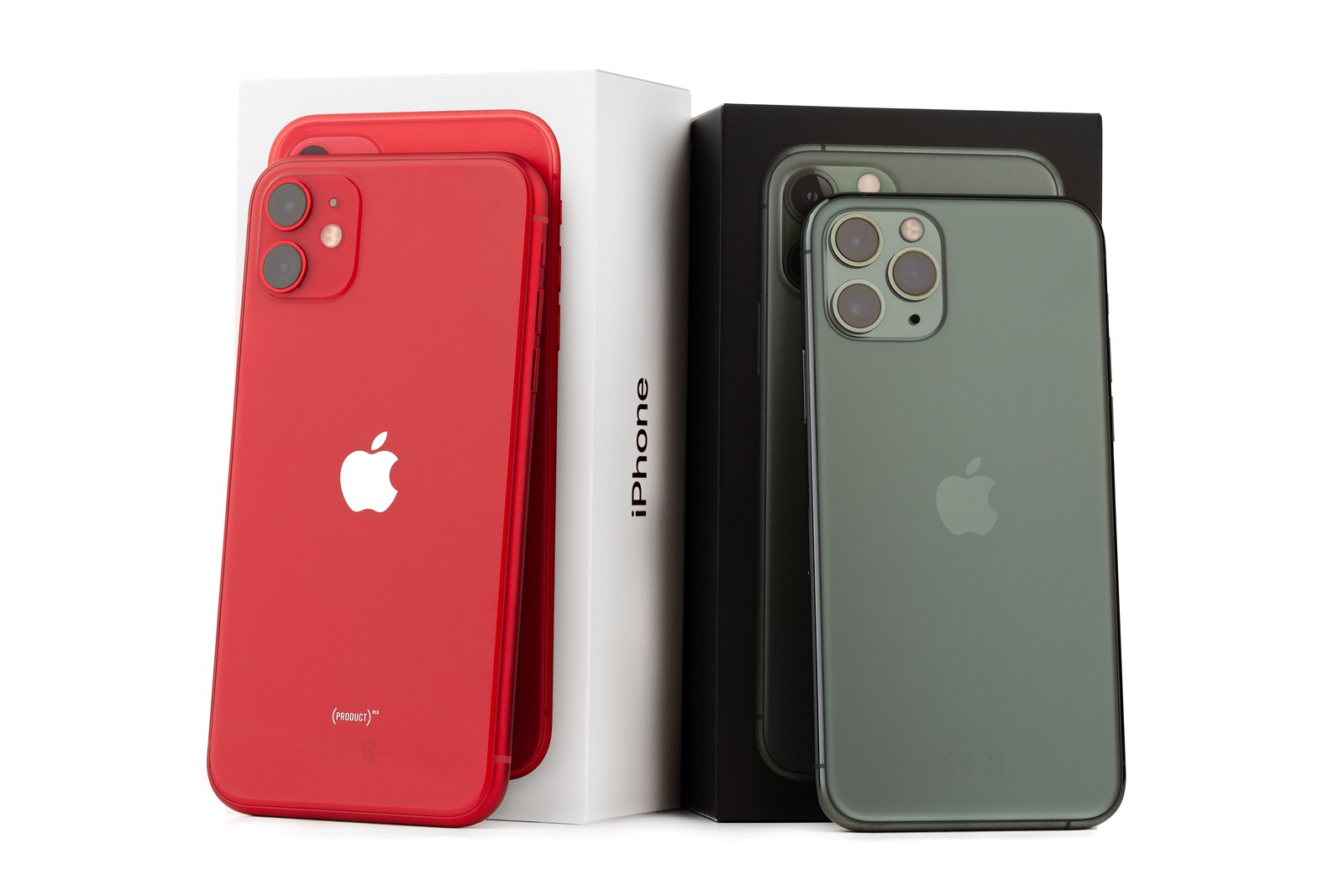 Rostov-on-Don, Russia - November 2019. Apple iPhone 11 PRODUCT RED and Apple iPhone 11 Pro Midnight Green on a white background. Two smartphones from Apple company close-up.