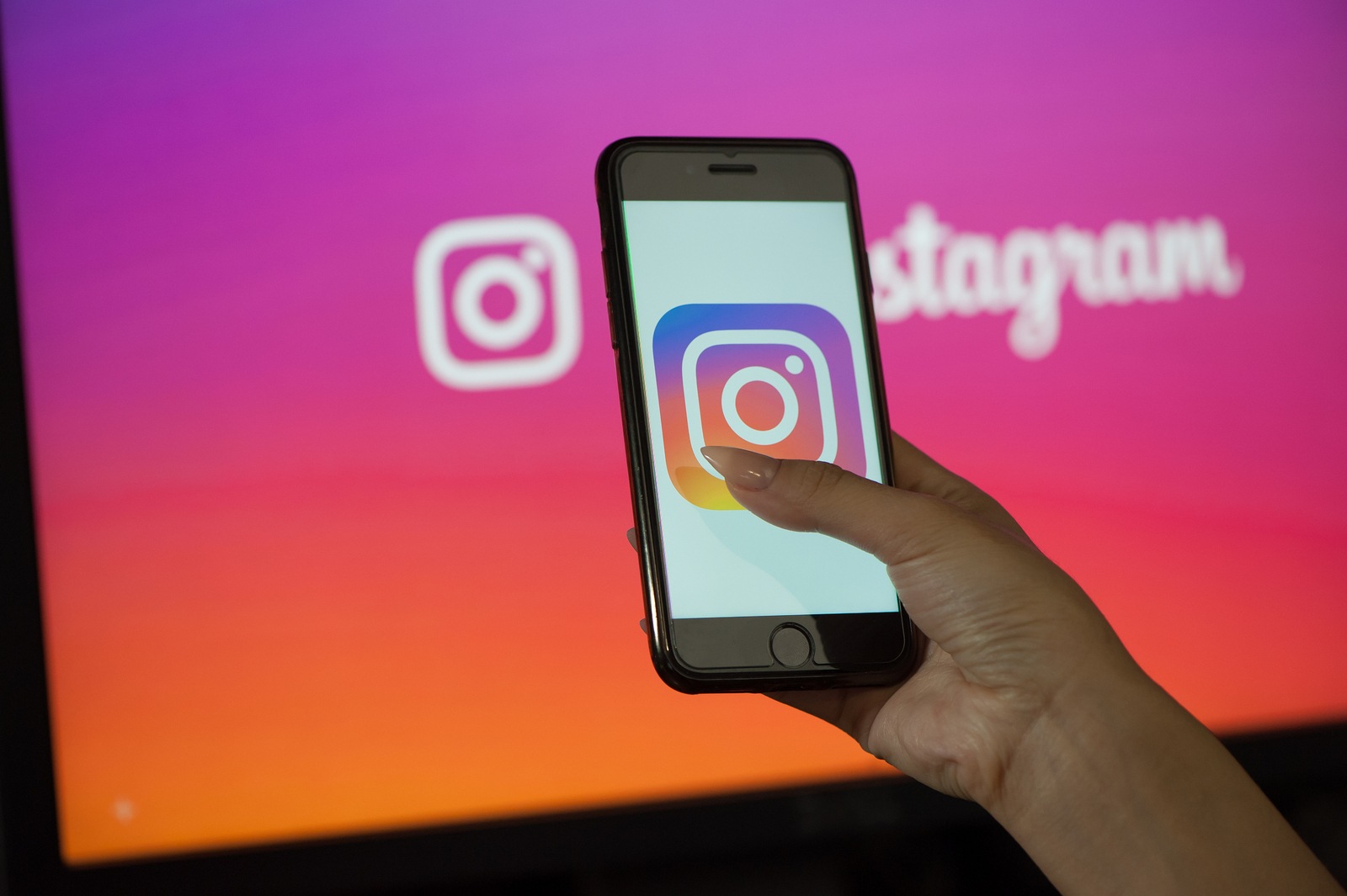 Saint-Petersburg / Russian Federation - 11 March 2019: Female hand holding cellphone with starting page of Instagram
