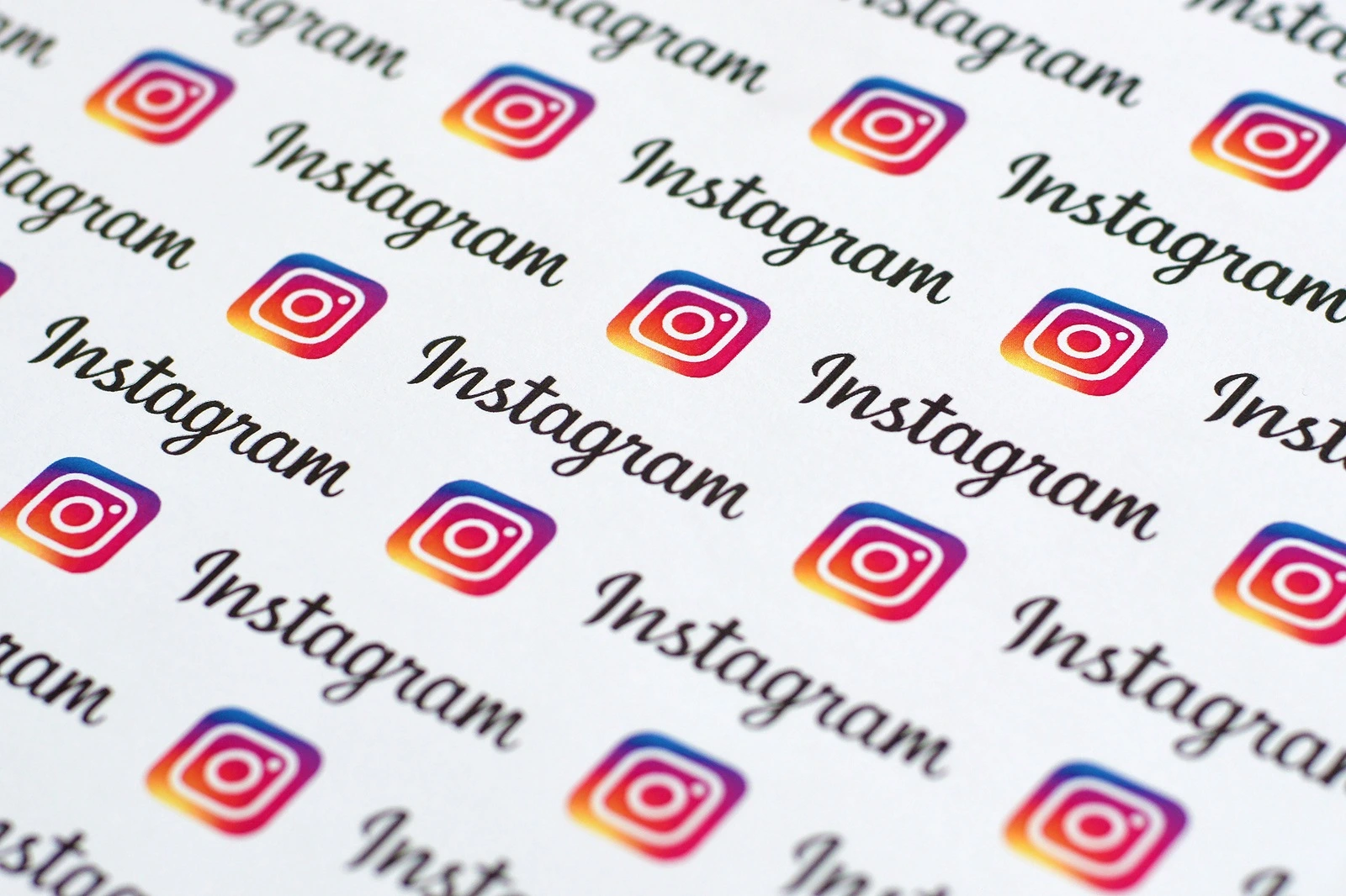 Instagram pattern printed on paper with small instagram logos and inscriptions. Instagram is American photo and video-sharing social networking service owned by Facebook