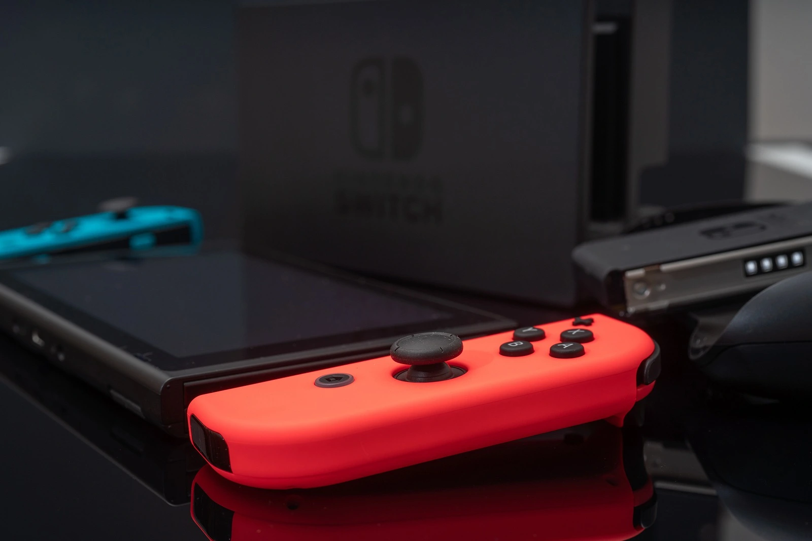 Nintendo Switch video game console developed by Nintendo, released on March 3, 2017 on a black background. Germany, Berlin - June 30, 2019: Nintendo Switch Joy-con controller on a white background