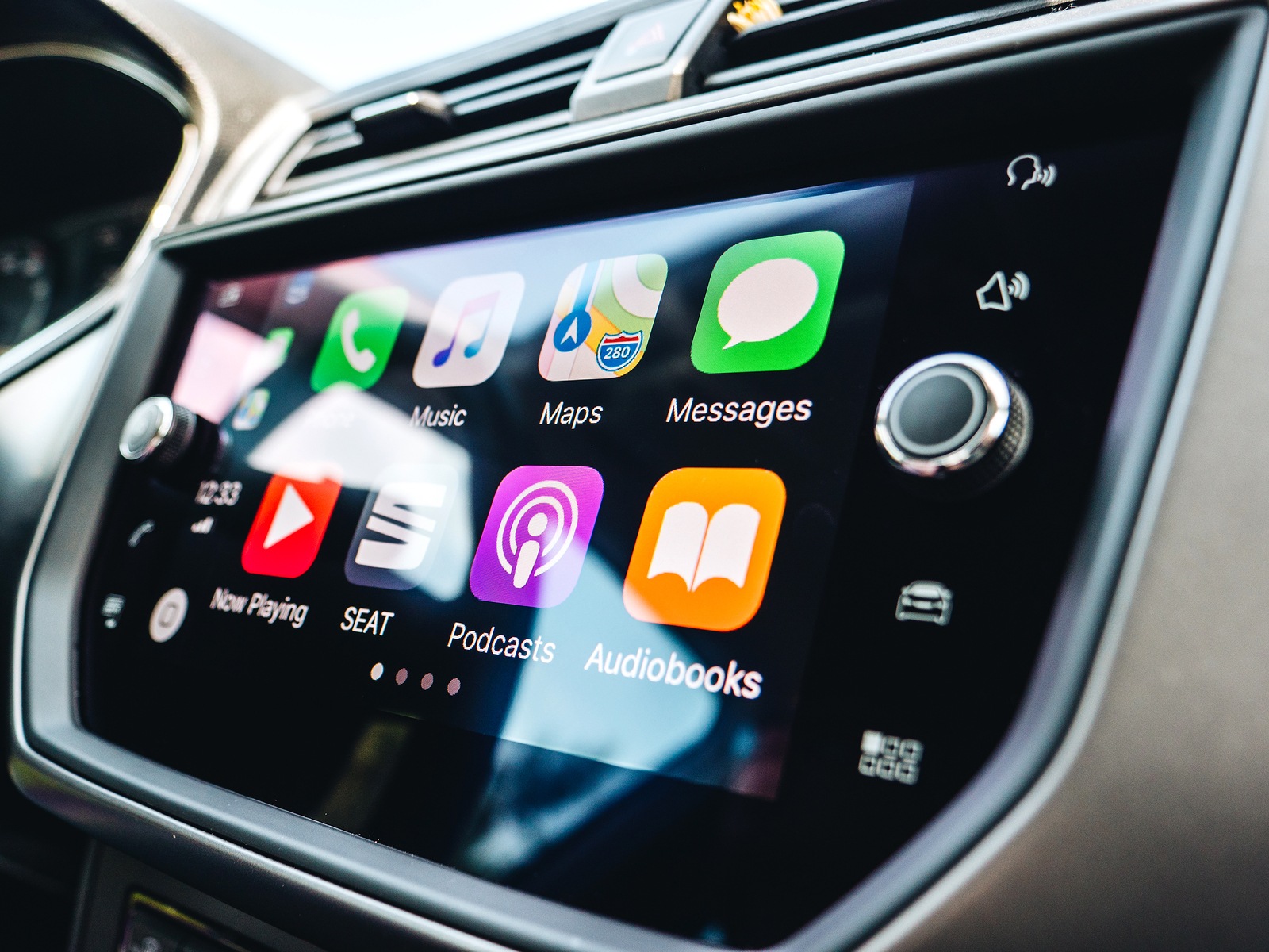 PALMA DE MALLORCA, SPAIN - MAY 10, 2018: Details of Apps and icons on the the Apple CarPlay main screen in modern car dashboard while driving