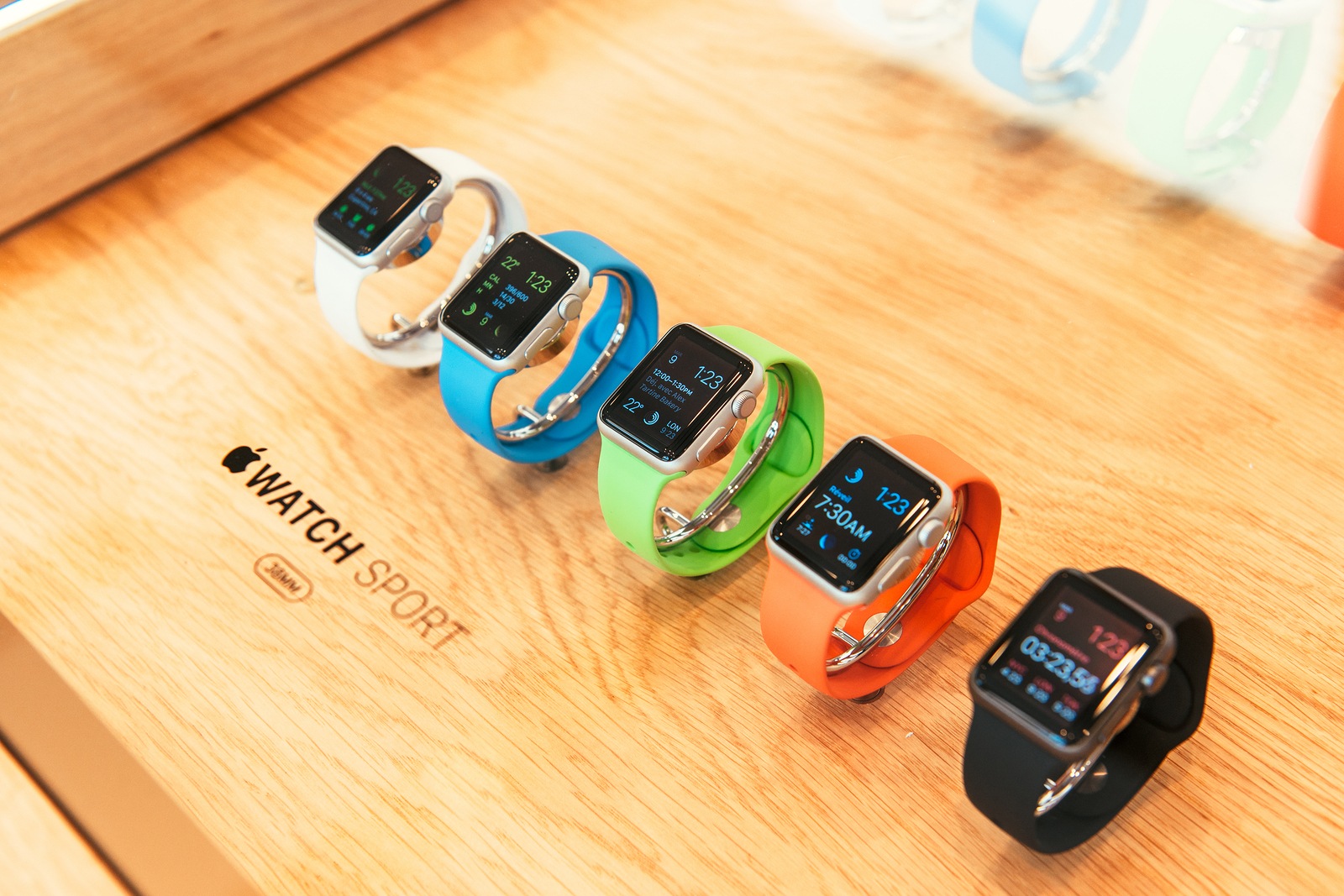 PARIS FRANCE - APR 10 2015: New wearable computer Apple Watch smartwatch displaying the Apple Sport Watch collection. Apple Watch incorporates fitness tracking and health-oriented capabilities and integration with iOS Apple products and services