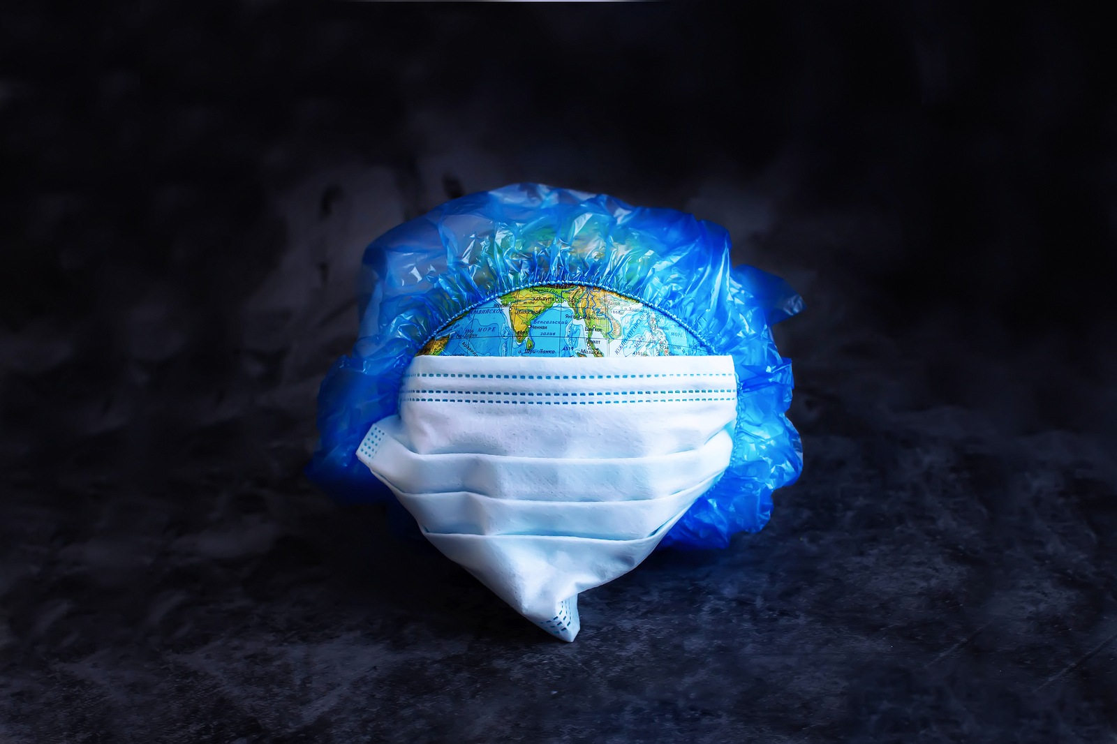 Earth planet in protective medical mask Isolated on white background. Novel rapidly spreading Coronavirus, 2019-nCoV pandemic.