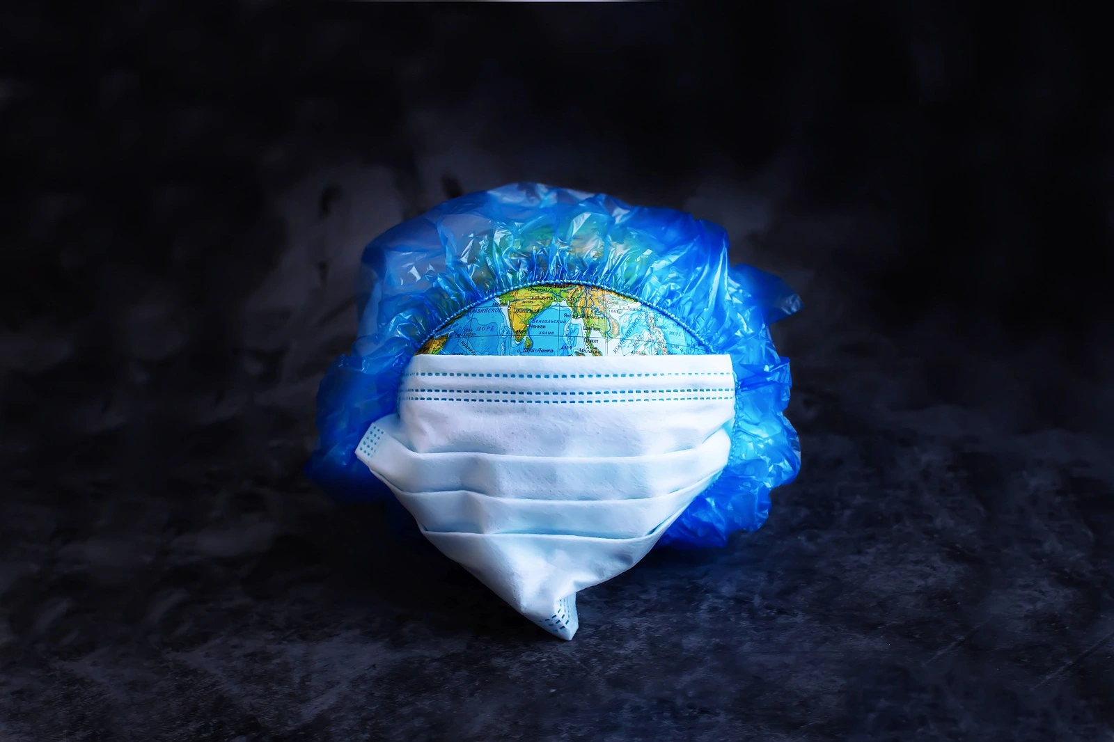 Earth planet in protective medical mask Isolated on white background. Novel rapidly spreading Coronavirus, 2019-nCoV pandemic.