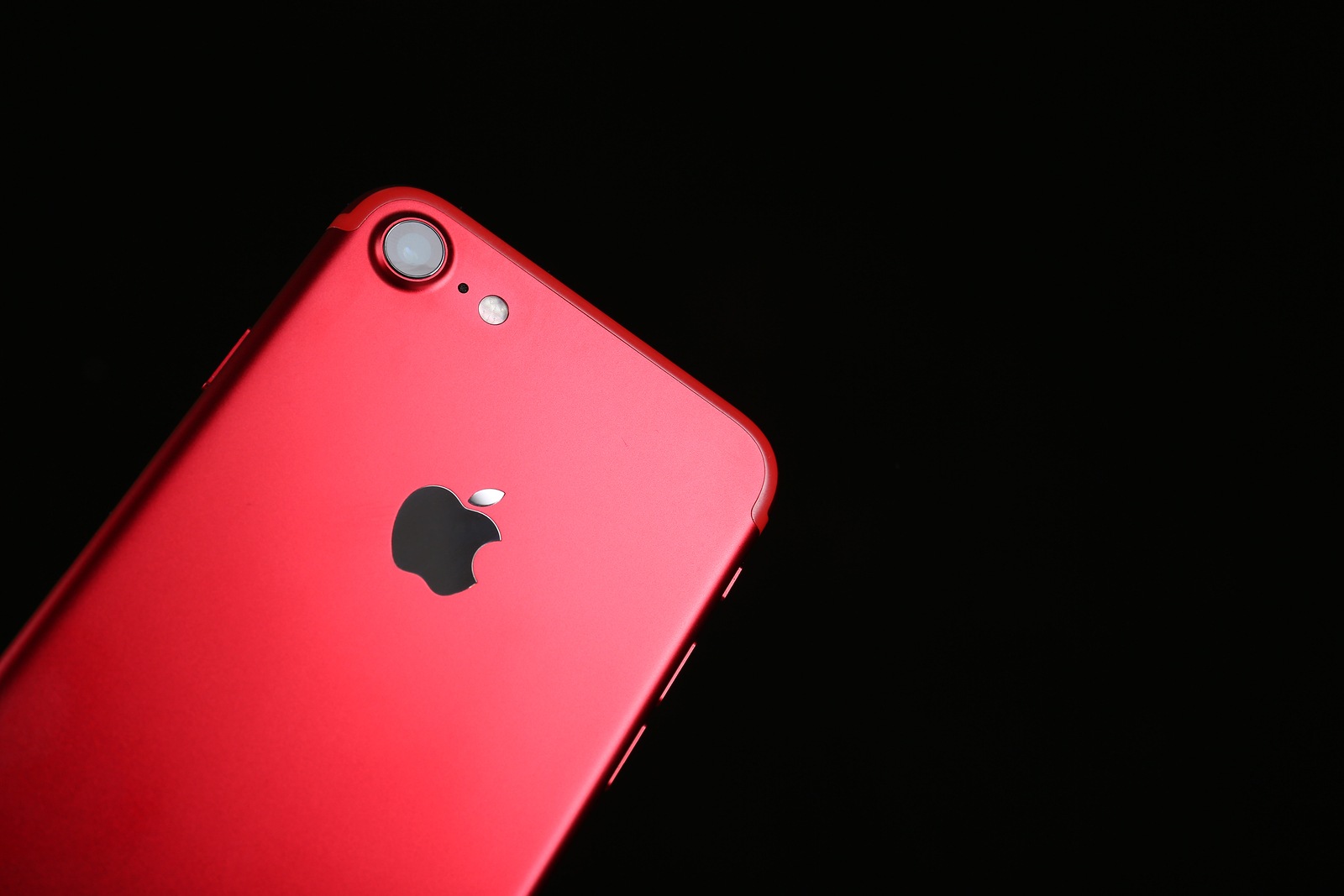 KIEV, UKRAINE - OCTOBER 23, 2017: Back panel of iPhone 7 Red on black background