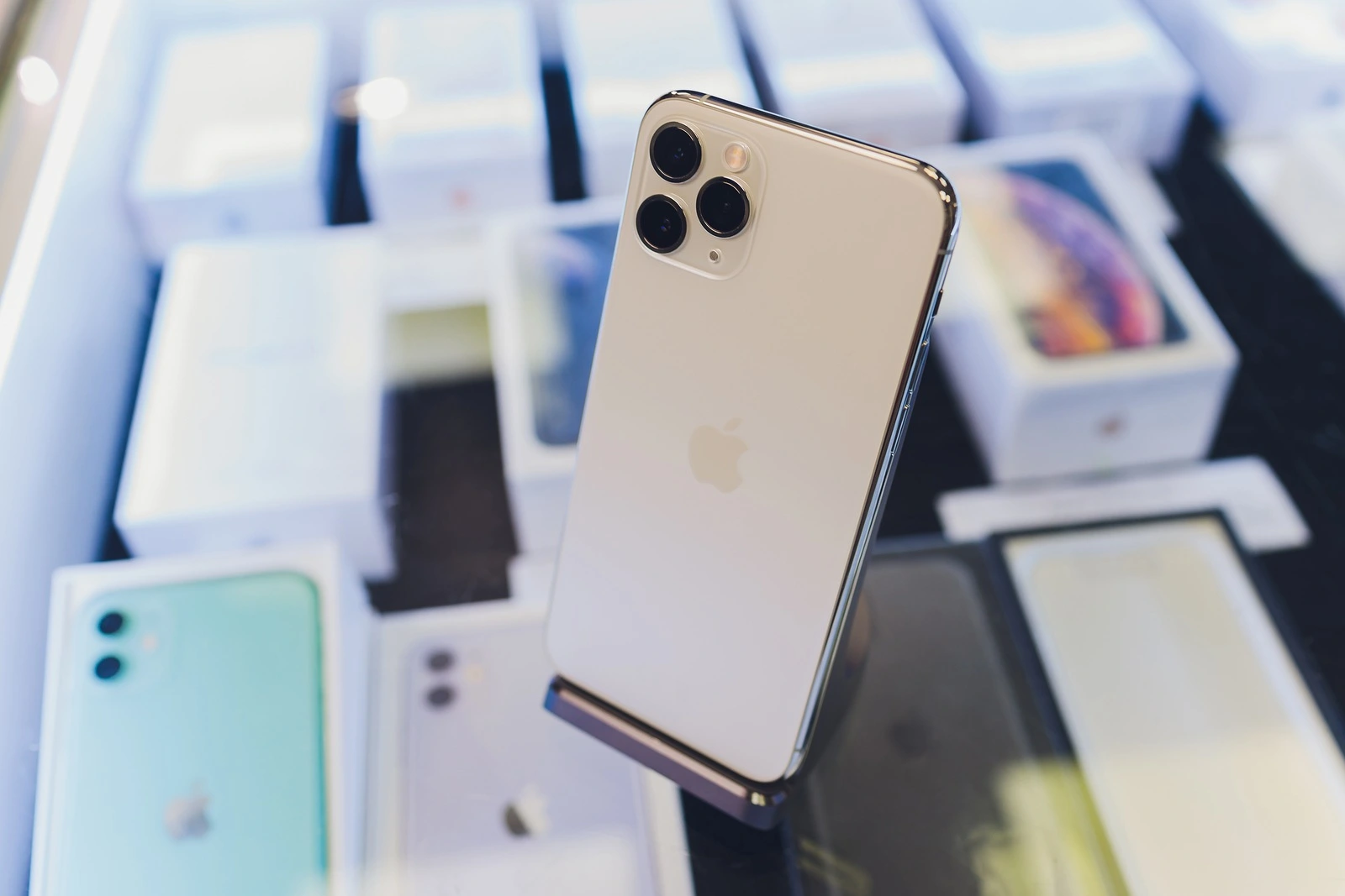 Ufa, Russia, 24 September, 2019: The iPhone 11, 11 Pro and Pro Max are displayed as the smartphone by Apple Computers goes on sale rear view of triple-camera.