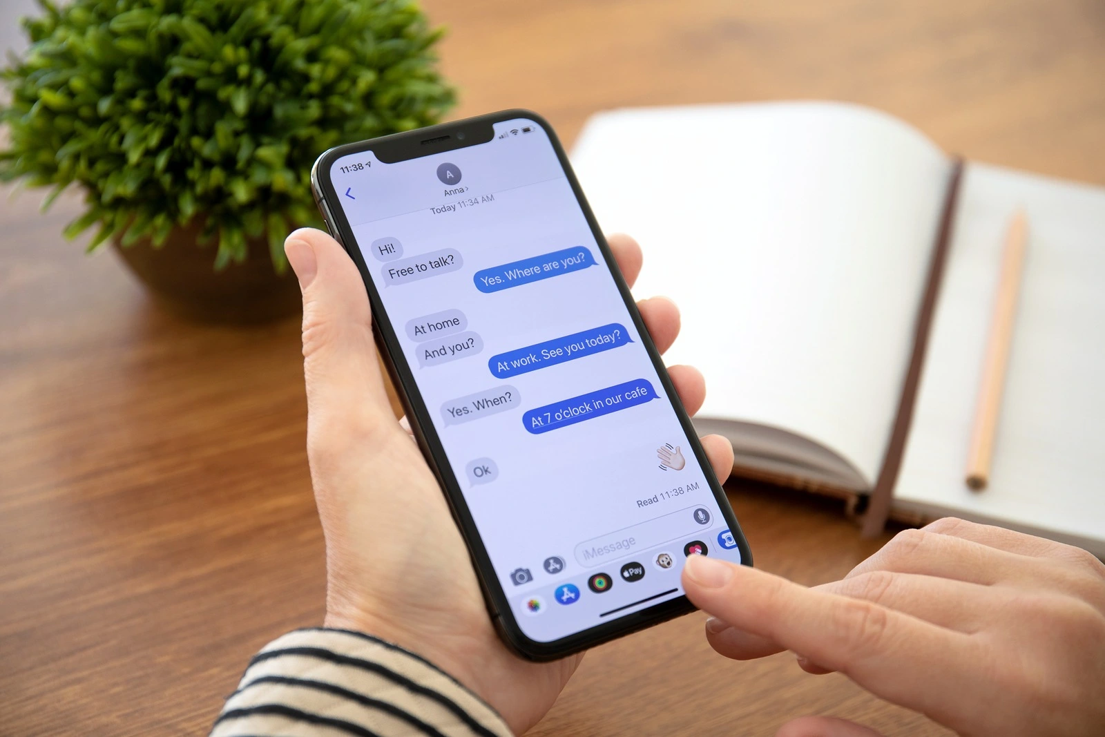 Alushta, Russia - September 26, 2018: Woman hand holding iPhone X with social networking service iMessage on the screen. iPhone 10 was created and developed by the Apple inc.