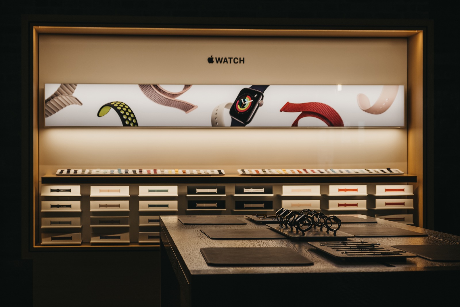London, UK - August 31,2019:Through the window view of the Apple watches on a table at Apple Store in Covent Garden, London, UK. Apple Covent Garden is Apples flagship store in UK refurbished in 2018