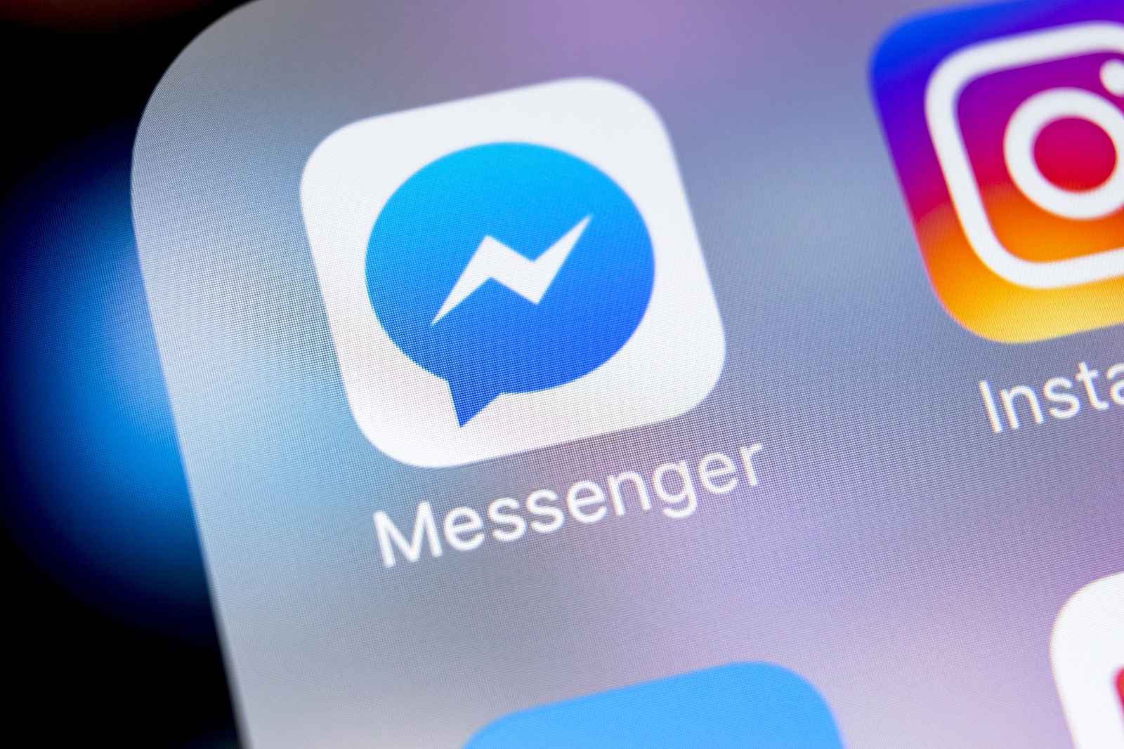 Sankt-Petersburg, Russia, March 7, 2018: Facebook messenger application icon on Apple iPhone X screen close-up. Facebook messenger app icon. Online internet social media network. Social media app