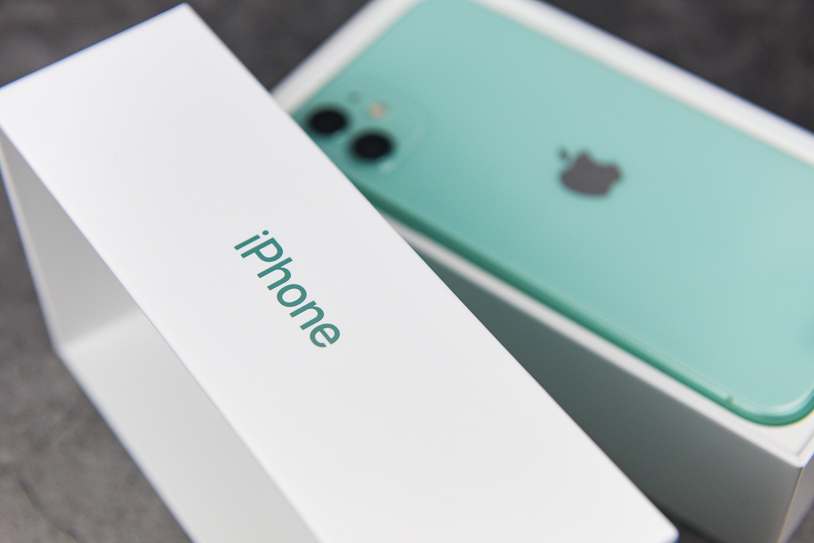 Bangkok, Thailand - November 30, 2019 : Smartphone New iPhone 11 green color and package box modern 2019 mobile phones / Buy a new mobile phone concept