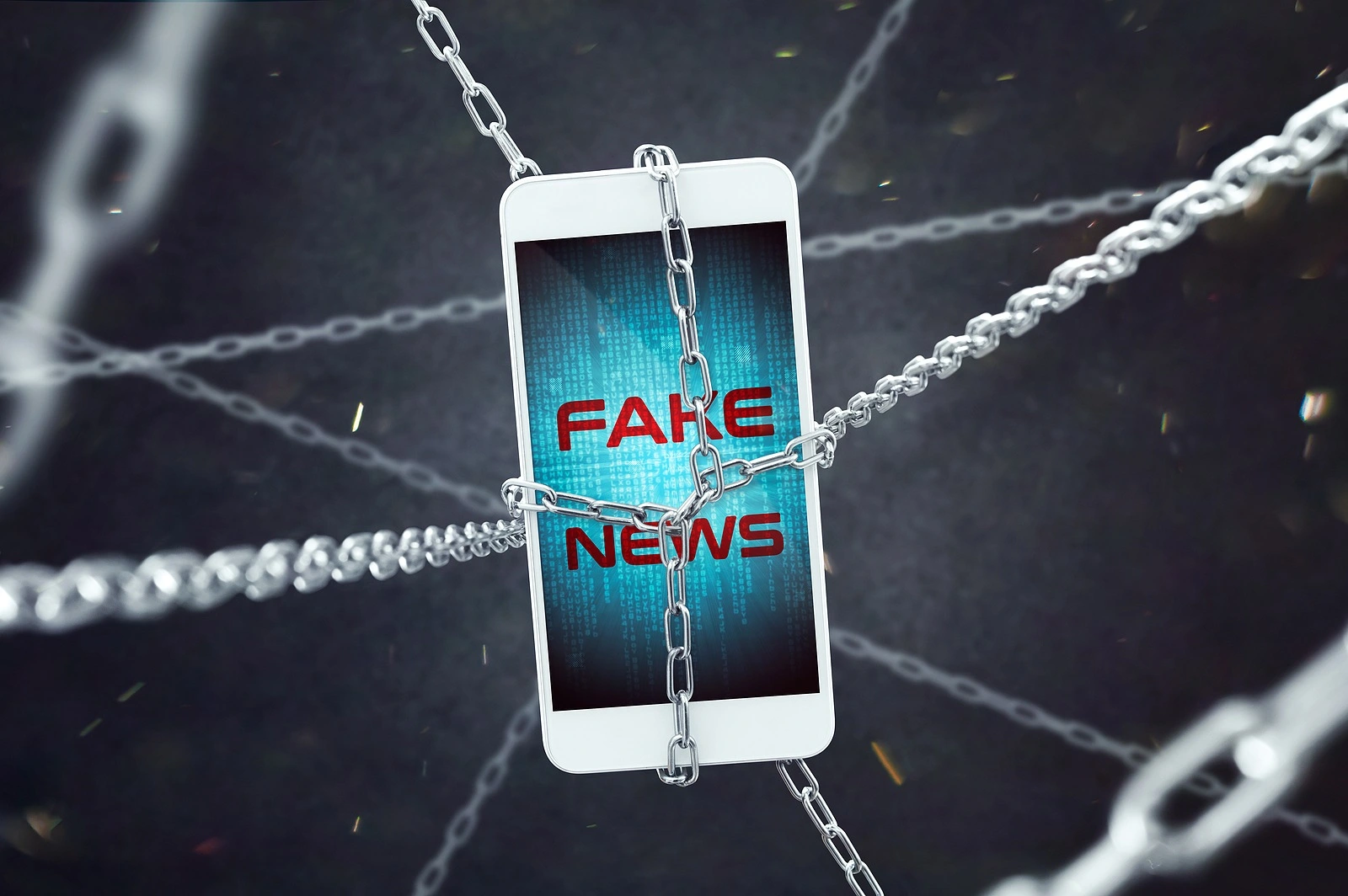 Smartphone with fake news inscription in chains. Conception of increasing problem of fake news.