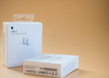 Bangkok - January 16, 2022 : A box of High power USB-C power adapter 20w by Apple on an orange surface with copy space