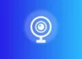 Apple Security Camera: gezeichnete Ringkamera mit Sockel auf blauem Verlauf