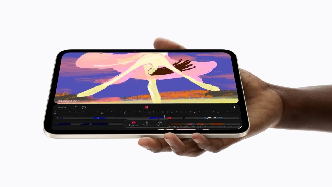Das iPad mini A20 Pro in Polarstern liegt quer in einer Hand und zeigt eine Animations-App