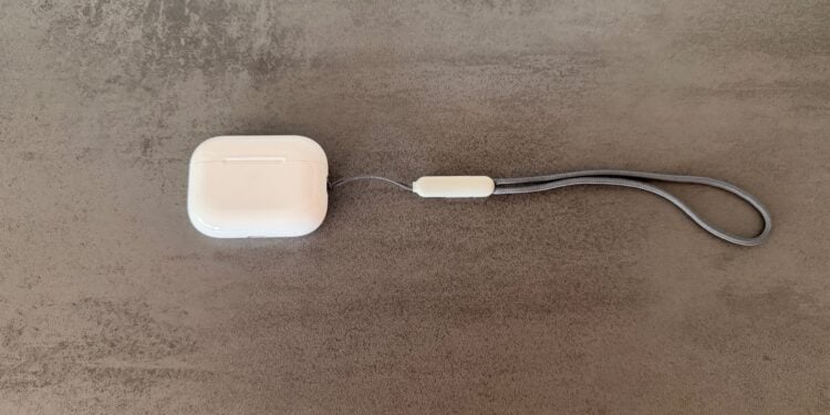 AirPods Pro 3 in white with closed charging case against a dark background