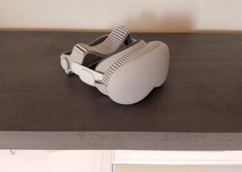 Apple Vision Pro with cover on a surface, photographed from the side