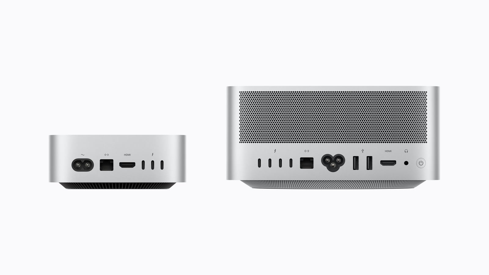 Rear sides of Mac mini and Mac Studio side by side to scale, three Thunderbolt ports on the left, four plus two USB-A on the right