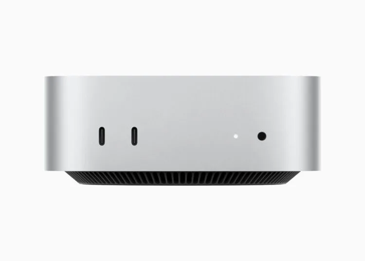 Mac mini in Silber von vorn mit zwei USB-C-Anschlüssen und Kopfhörerbuchse