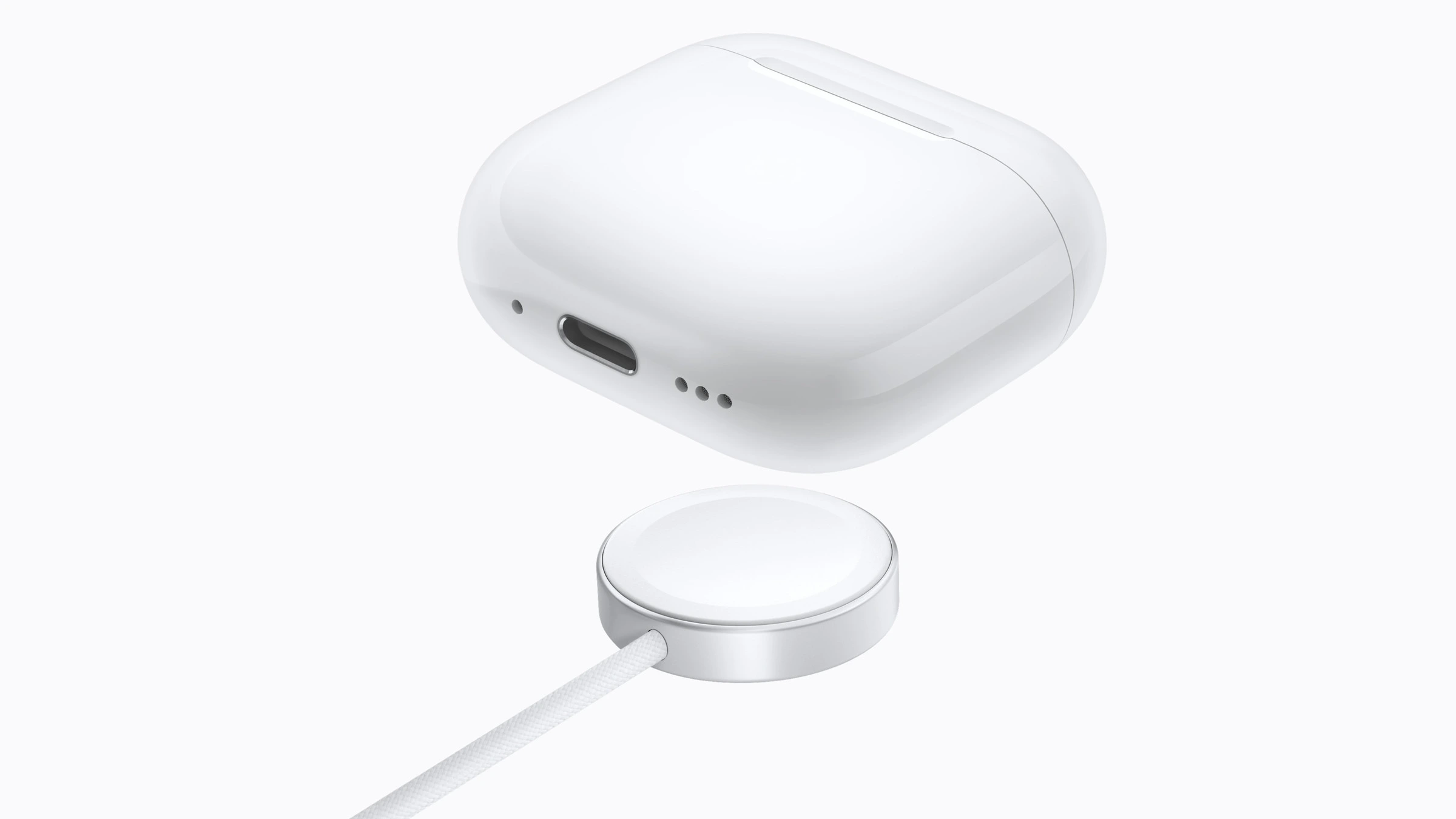 Kabelloses Ladecase der AirPods 5 über einem Apple Watch Ladegerät