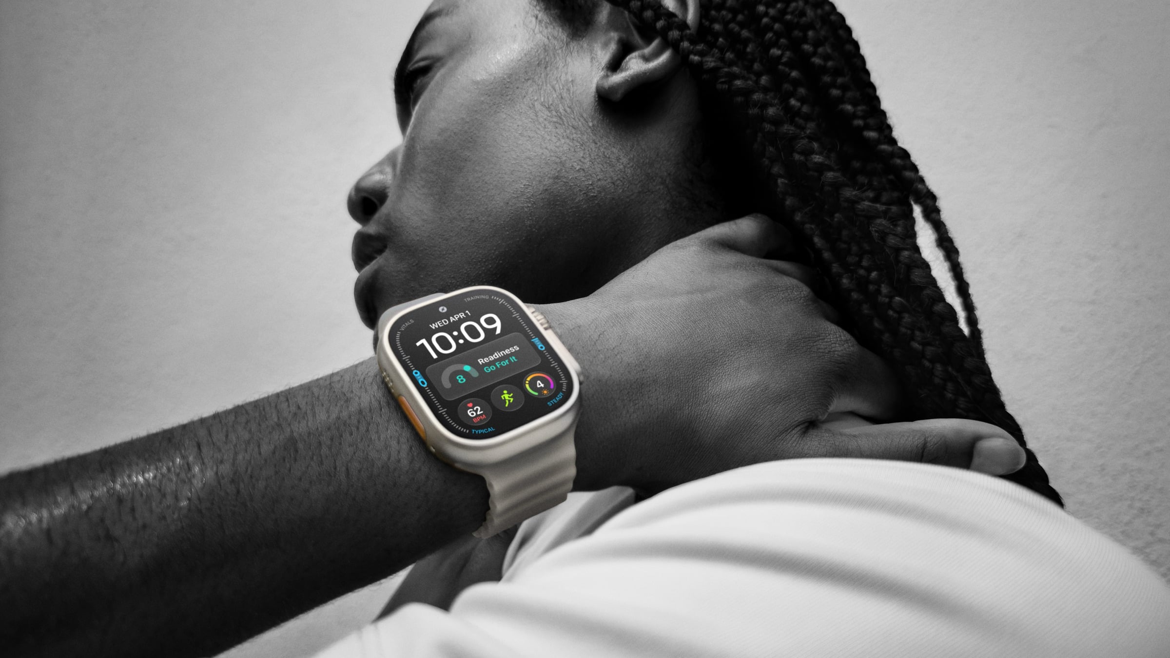 Apple Watch Ultra 4 with Ocean band on a person's wrist, the display showing the readiness score