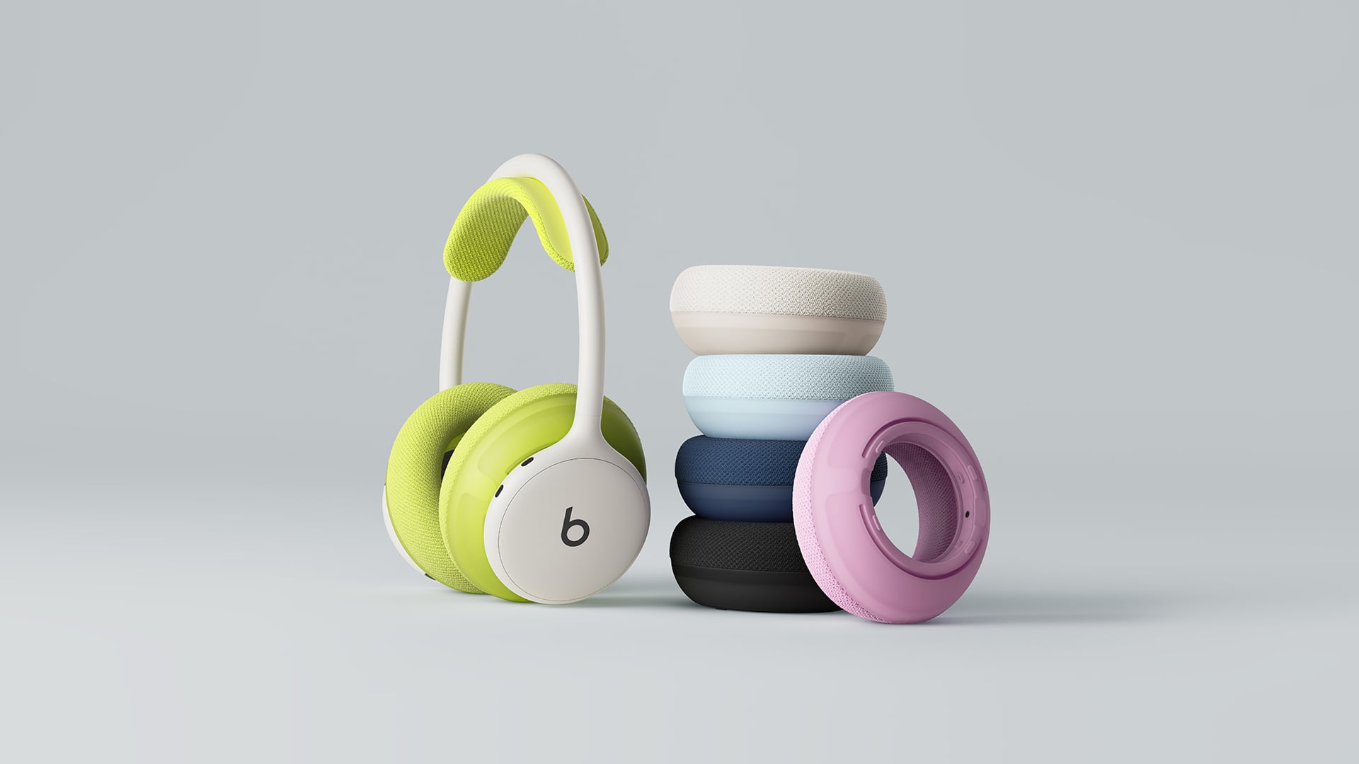 Beats 360 in Volt next to a stack of Performance Knit cushions
