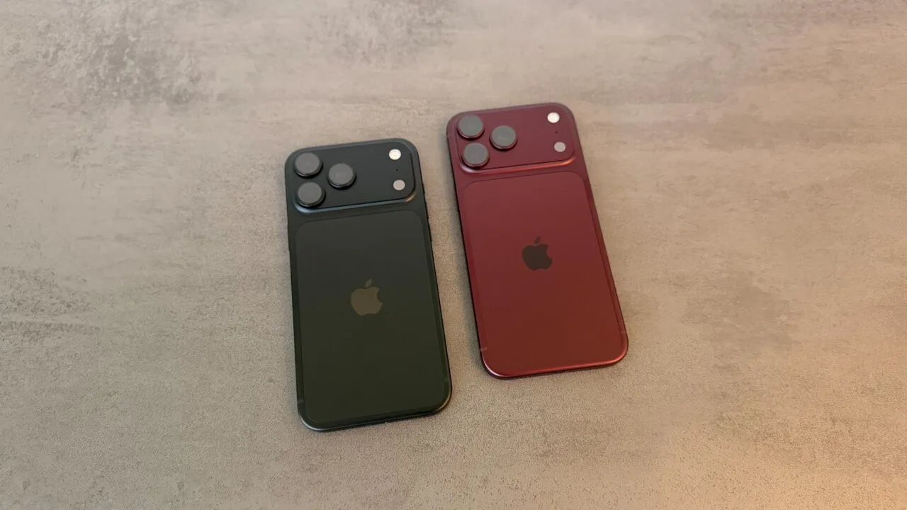 Apple-Aktie Kursziel: zwei iPhone 18 Pro Max in Schwarz und Burgunder liegen mit der Rückseite nach oben auf einer grauen Steinplatte