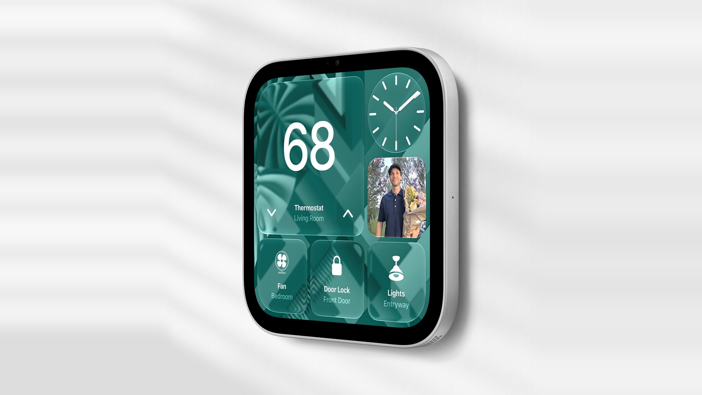 Wall-mounted Apple HomeView showing controls for thermostat, fan, door lock and lights alongside the front door camera feed