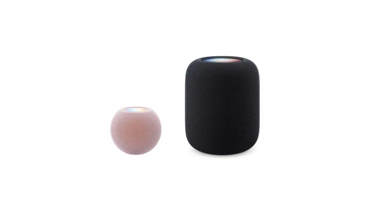 HomePod mini vs. HomePod: HomePod mini 2 in Rosa neben dem deutlich größeren HomePod 2 in Mitternacht, beide maßstabsgetreu nebeneinander