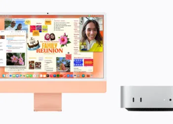 iMac vs. Mac mini: iMac in Orange mit geöffneter Notizen-App neben einem silbernen Mac mini, Vorderseite mit zwei USB-C-Anschlüssen und Kopfhörerbuchse