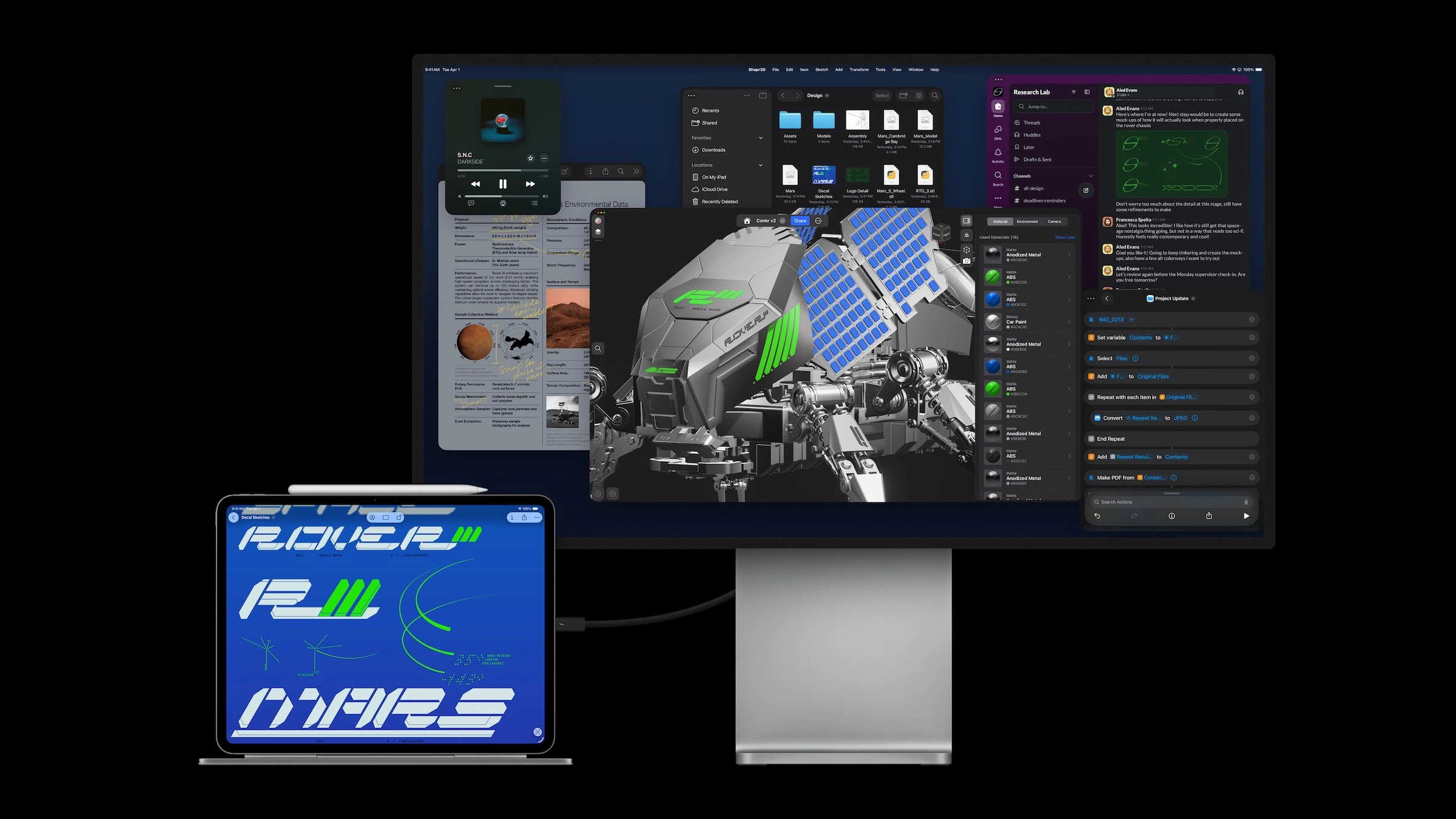 iPad Pro vs. MacBook Pro: das iPad Pro mit Magic Keyboard und Apple Pencil, per Kabel an ein großes externes Display mit mehreren App-Fenstern angeschlossen