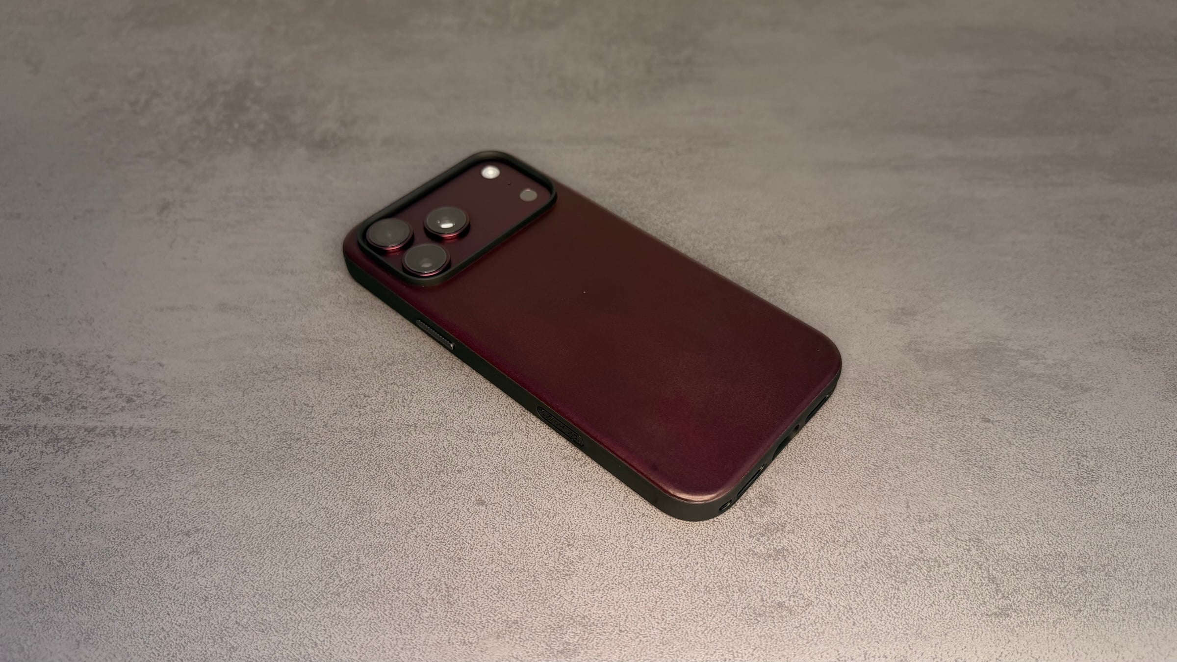 Nomad cases iPhone 18 Pro: Modern Leather Case in Burgundy with a black frame around the camera module