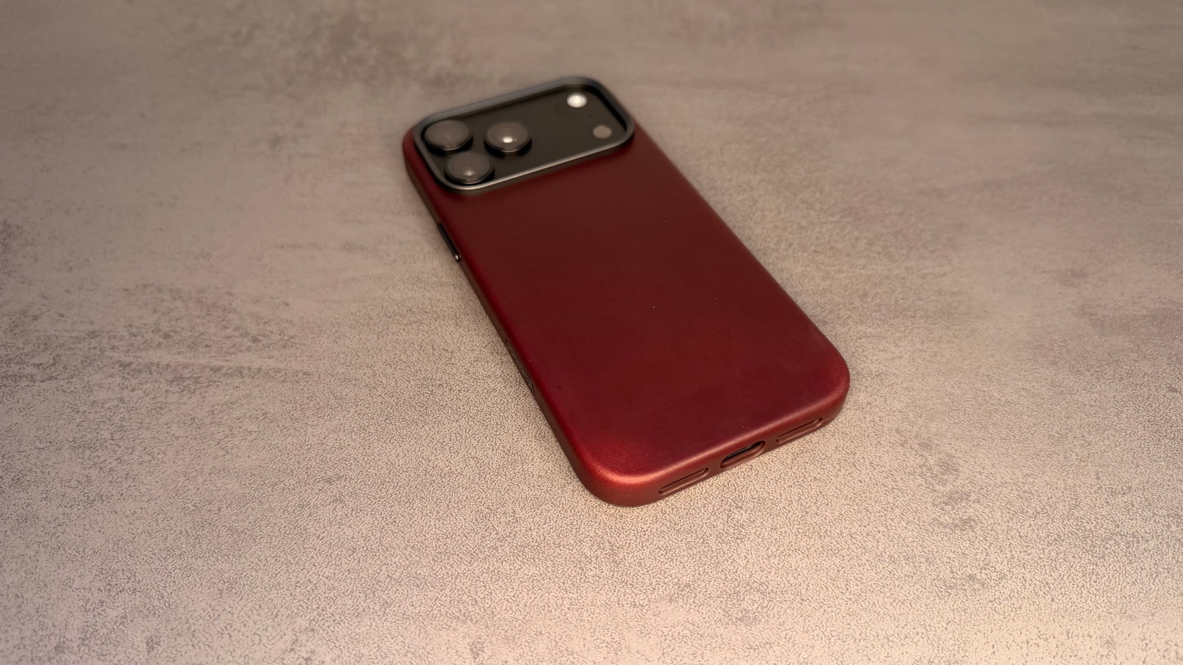 Nomad cases iPhone 18 Pro: Traditional Leather Case in Burgundy with the leather wrapping over the bottom edge
