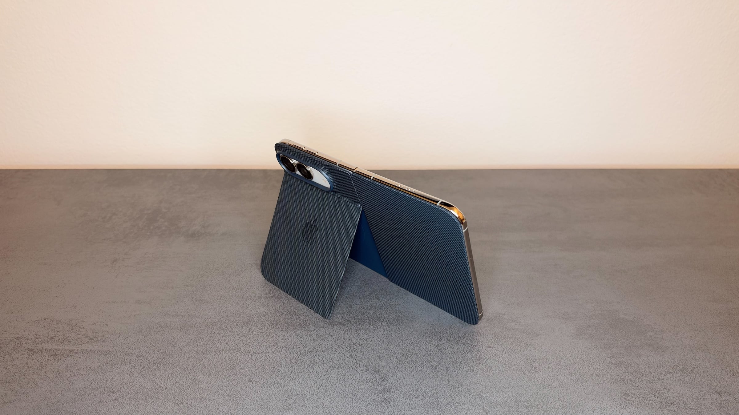 iPhone Duo in the blue Folio, propped up on its folded-out stand, part of the first everyday impression