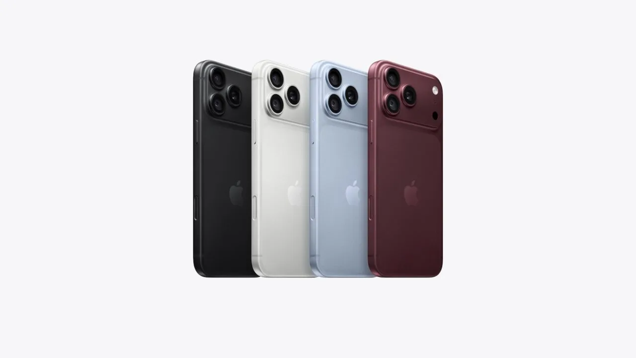 iPhone Marktanteil auf Rekordniveau: die aktuellen Pro-Modelle in Schwarz, Weiß, Hellblau und Burgunder nebeneinander von hinten