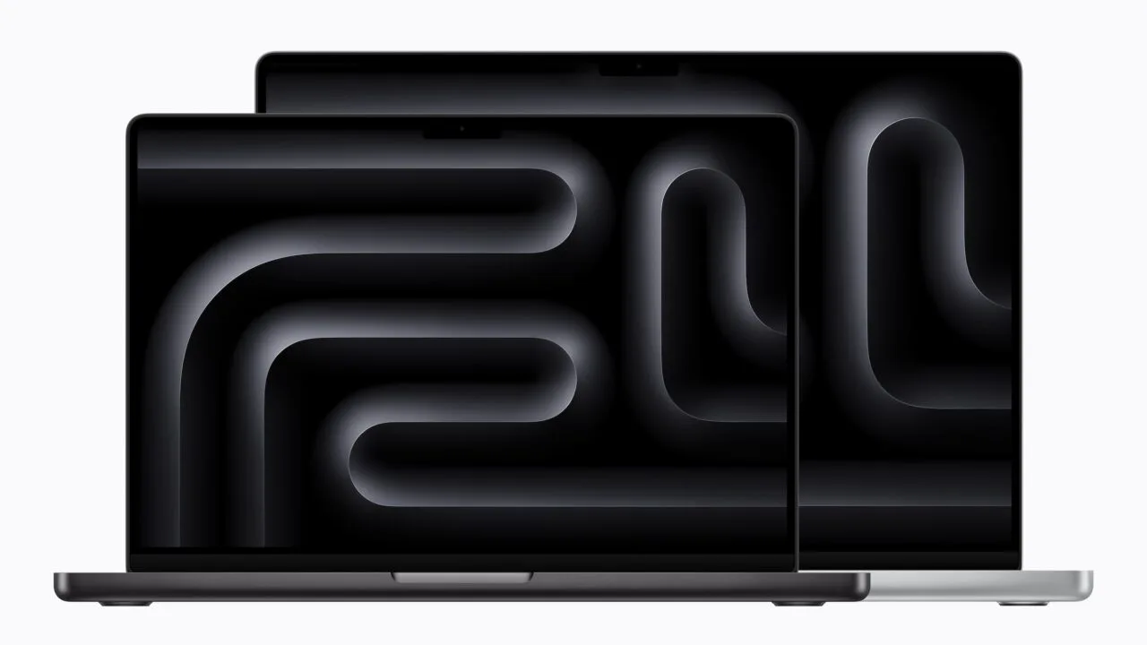 Zwei aufgeklappte MacBook Pro in Space Schwarz und Silber mit Notch am oberen Displayrand, das bisherige Design vor dem MacBook Pro Touchscreen